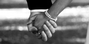 Bride and Groom Hold Hands